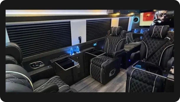 The Avalon — black Mercedes-Benz Sprinter limousine in side profile at dusk with blue underglow, Excalibur Executive, Oklahoma