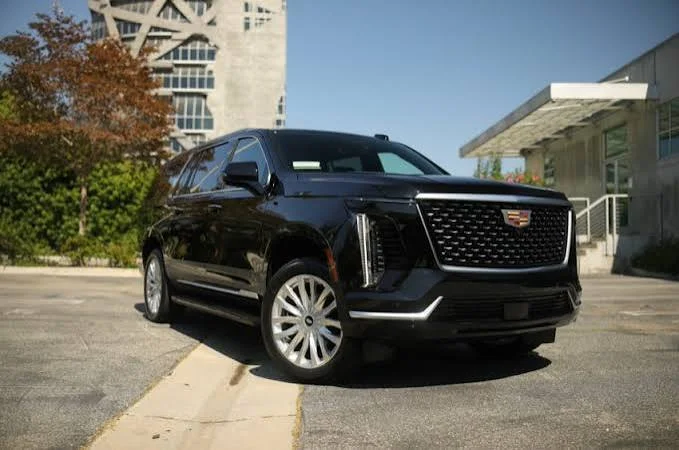 Black Cadillac Escalade ESV, front three-quarter view, Excalibur Executive
