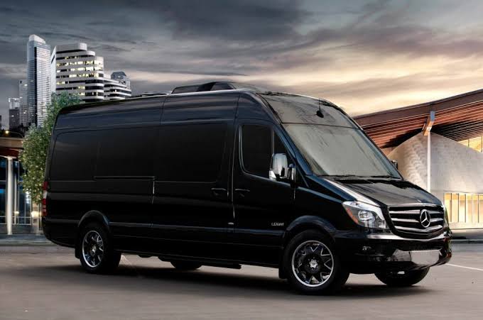 The Monarch Maybach luxury Sprinter, front three-quarter view, Excalibur Executive
